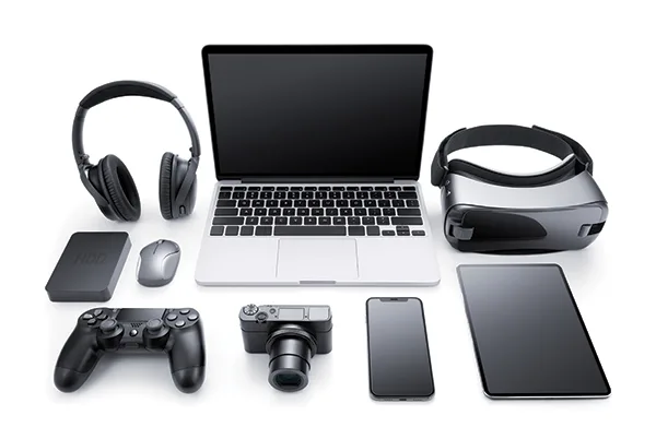 Collection of modern technology devices including laptop, VR headset, wireless headphones, gaming controller, digital camera, smartphone, tablet, mouse, and external hard drive arranged on white background